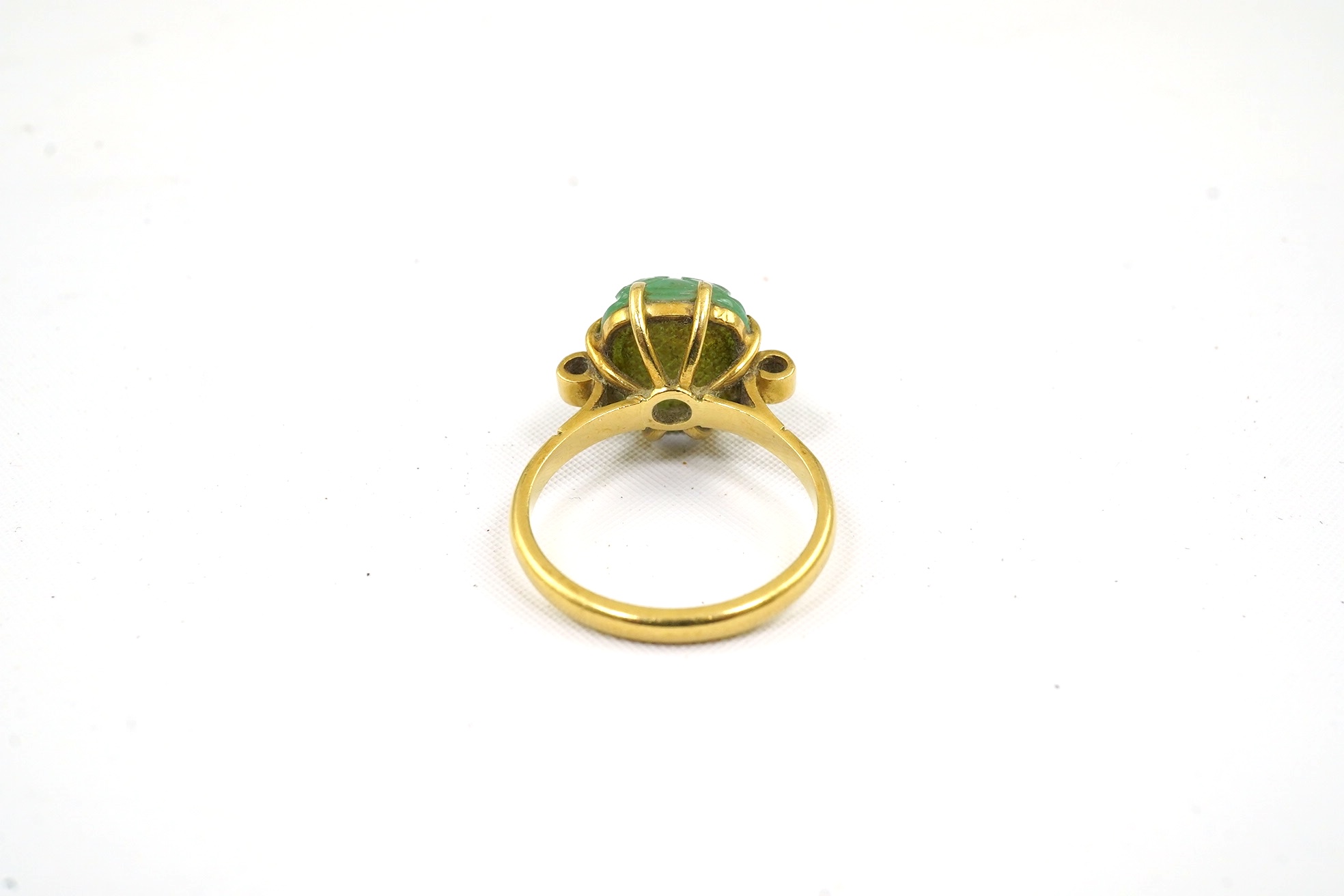 A mid 20th century 18ct gold and single stone emerald set ring